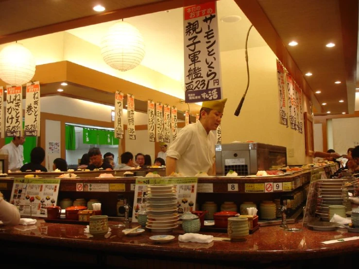 a man working behind the counter in a restaurant