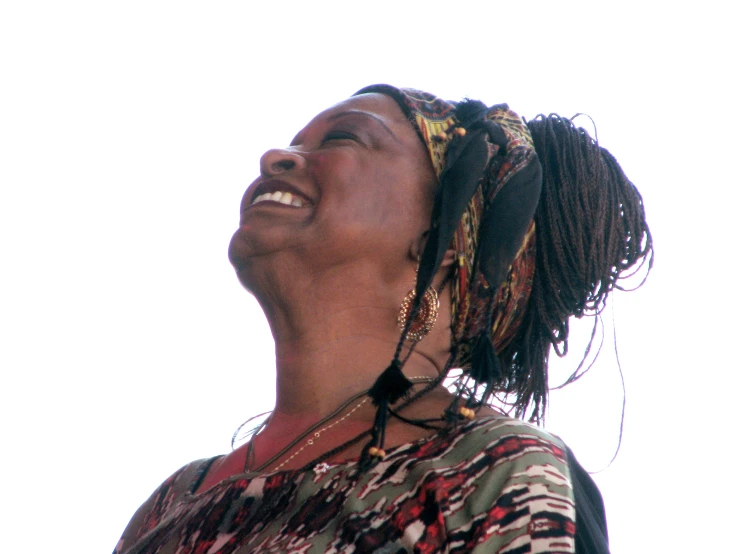 a woman wearing a head scarf and smiling