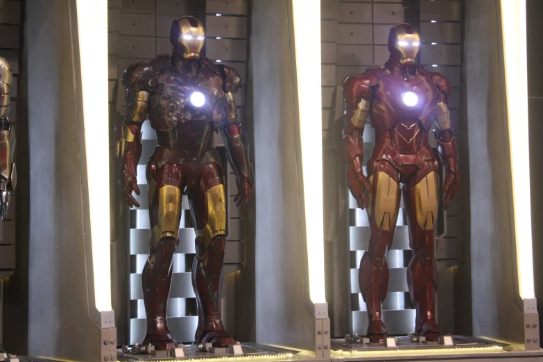 iron man suits are in the windows of a store
