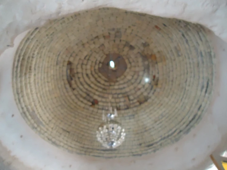 a round water fountain made with a circular pattern