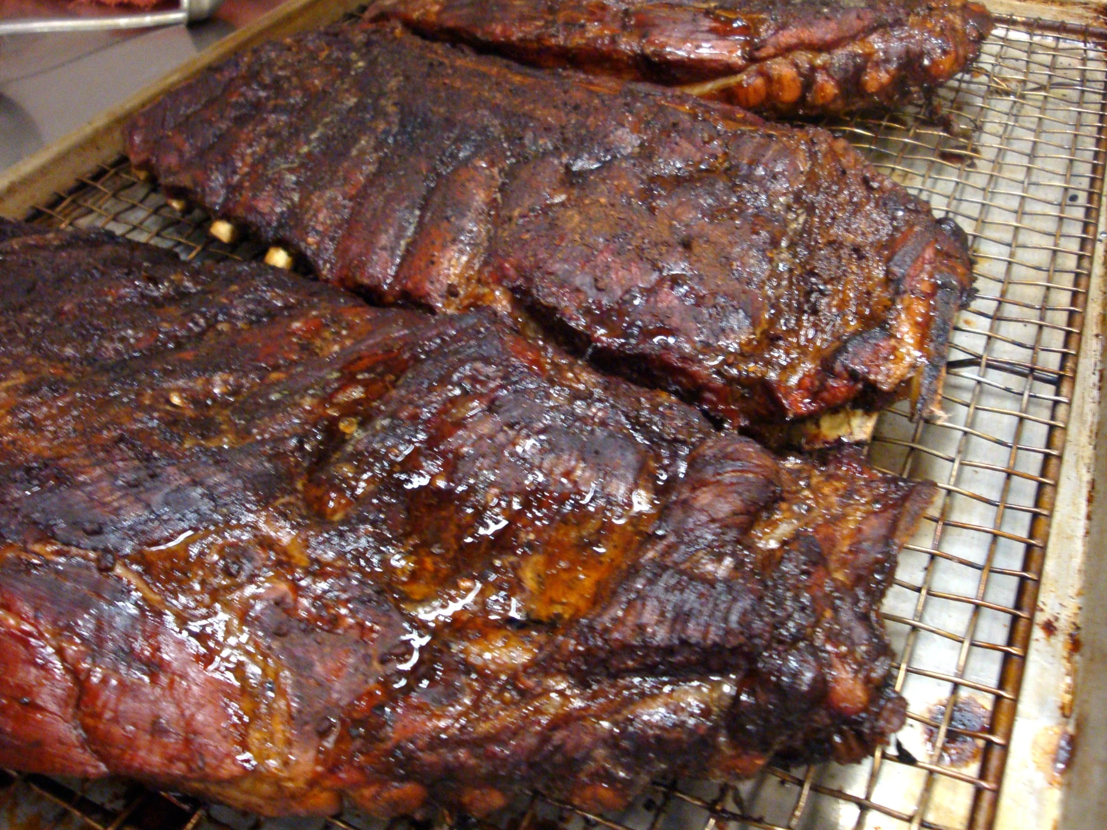 ribs that are on top of a grill