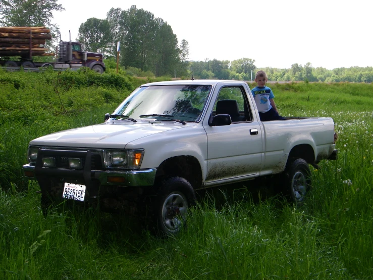 a truck that is sitting in the grass