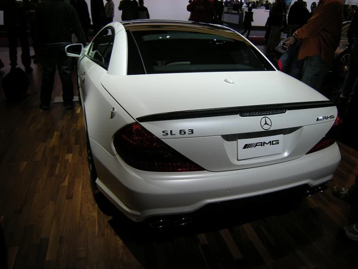 the front of a mercedes car is shown during the day