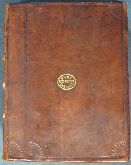 an old brown leather album with the word
