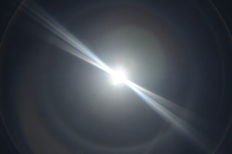 a very bright lens on a bright blue sky