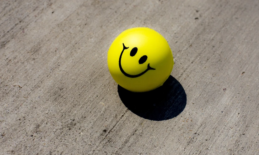 a ball with a smiling face drawn on it