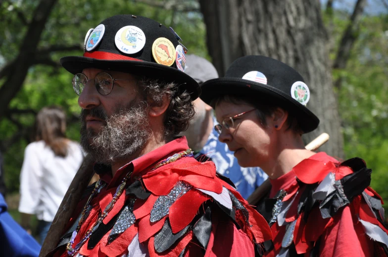 two people in costume, one in a red vest