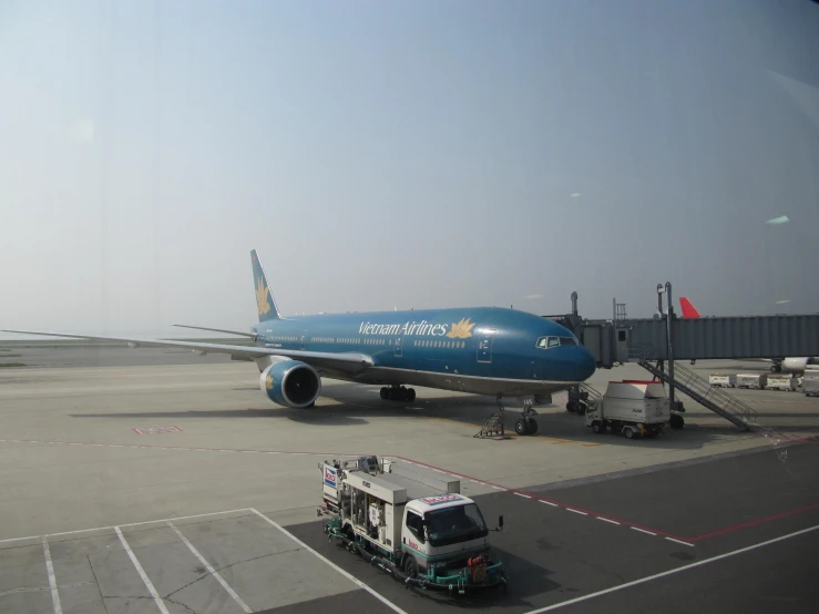 an airplane is being towed along an airport runway