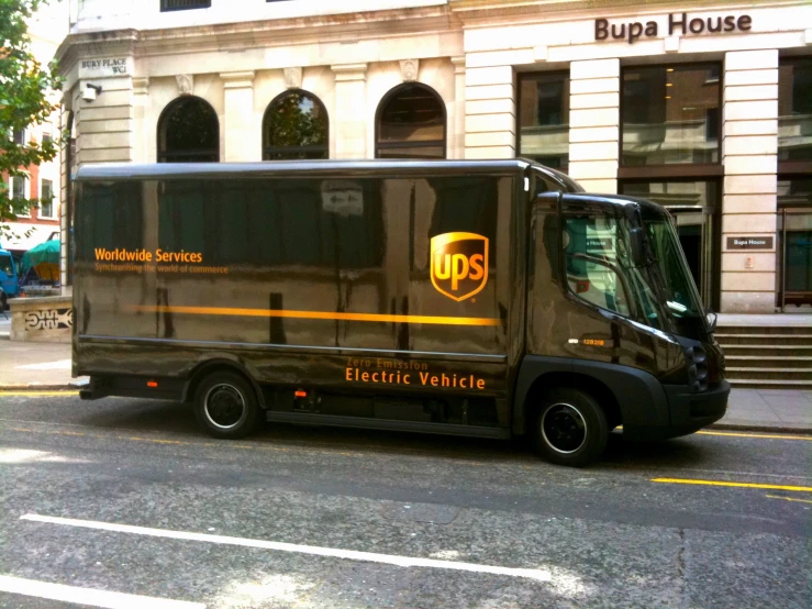 a ups bus parked in front of a building