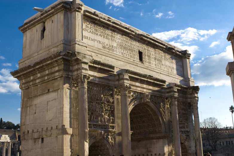 an ornate building has two arches and is surrounded by pillars