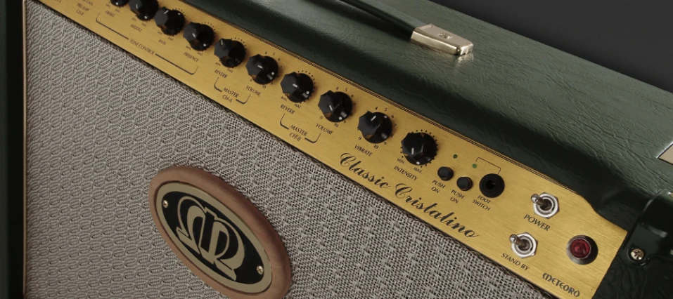 closeup of a yellow and green guitar amplifier