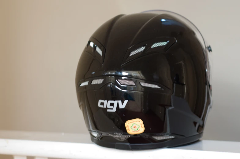 an open face helmet mounted on a shelf