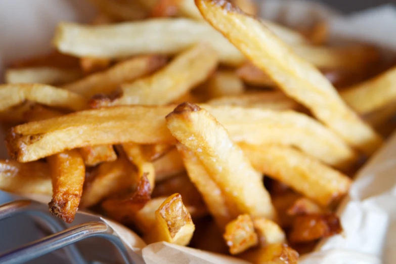 some french fries are sitting in a basket