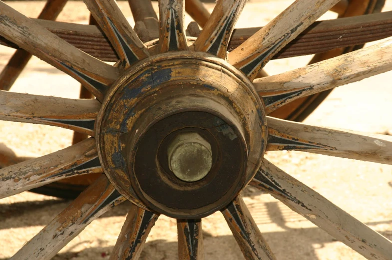 an old weathered wagon wheel that was made to look like an outdoor gazebo