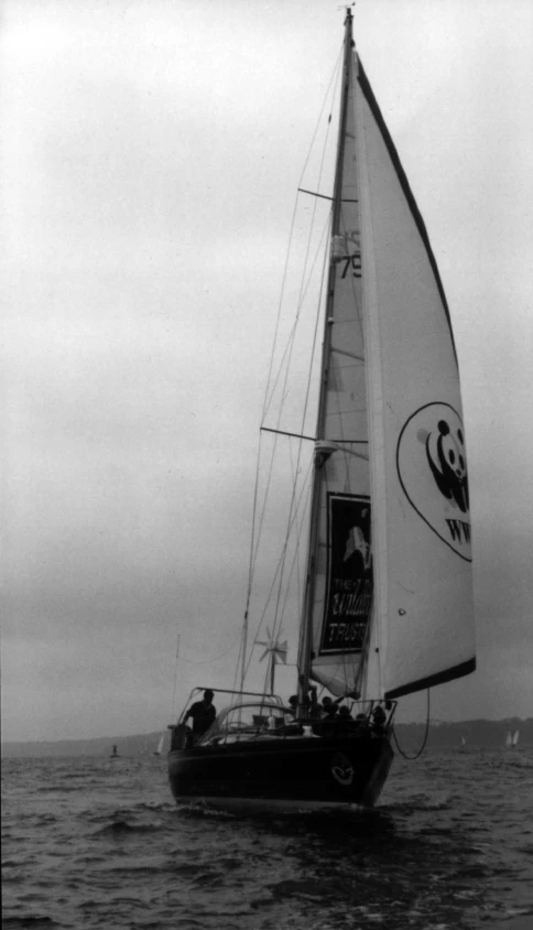 black and white pograph of a sailboat on the water