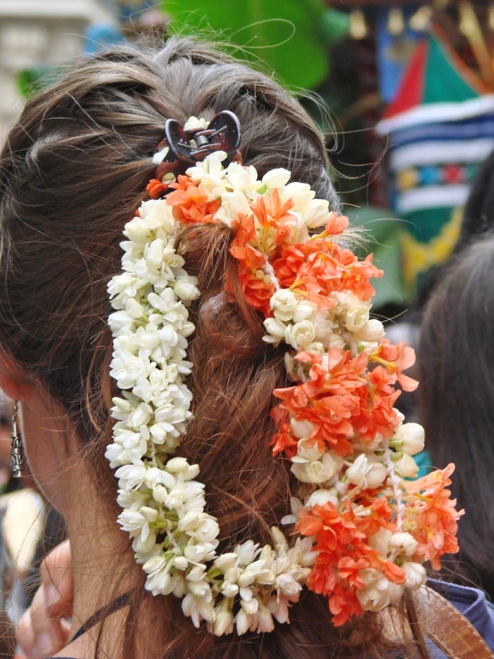 a woman in ids with flowers and two pairs of scissors