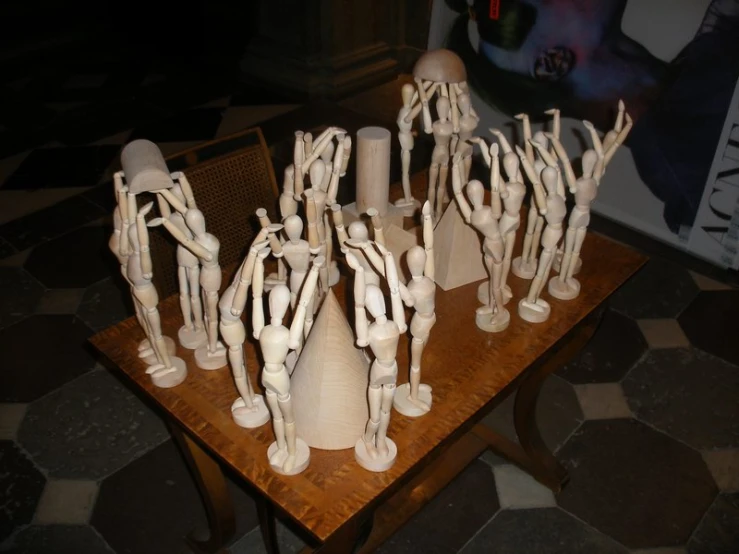 group of ceramic figures on small table in room