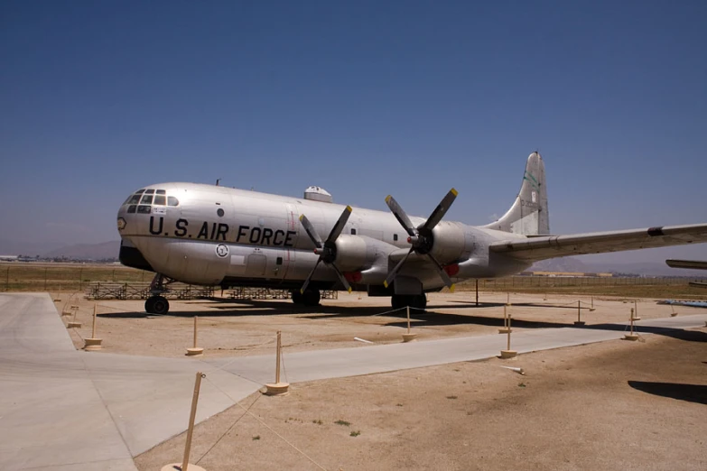 an old us air force plane is displayed on a tarmac