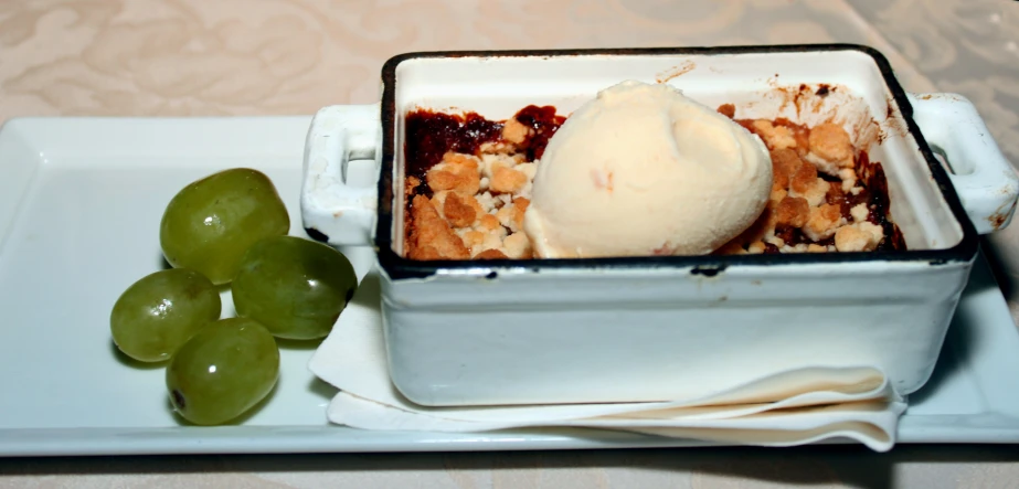 an ice cream sundae with gs on a table