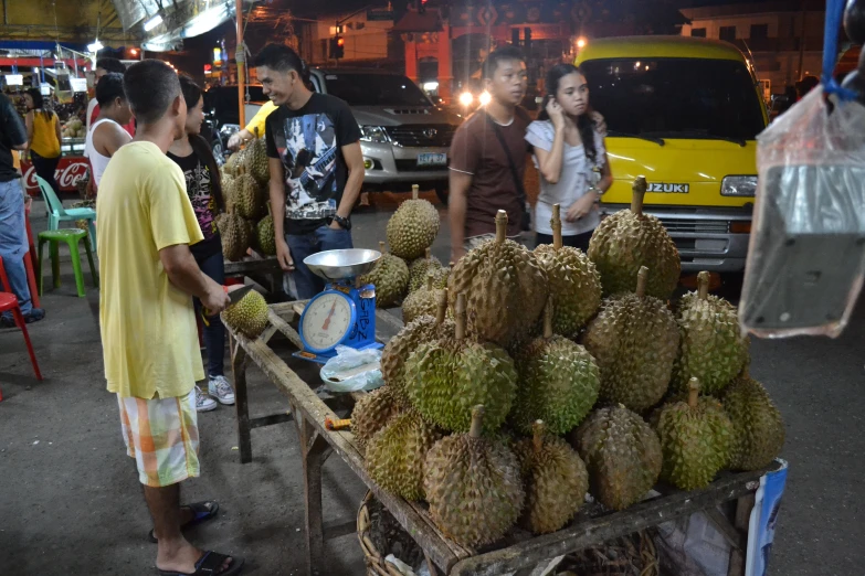 the people are waiting at the stand for their foods