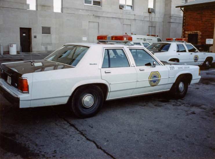 two police cars parked in a parking lot