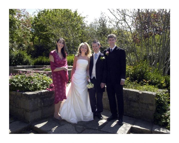 three people in formal clothes posing for the camera