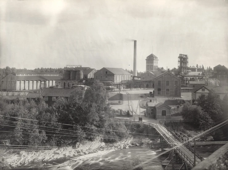 an old po of factory buildings in the back