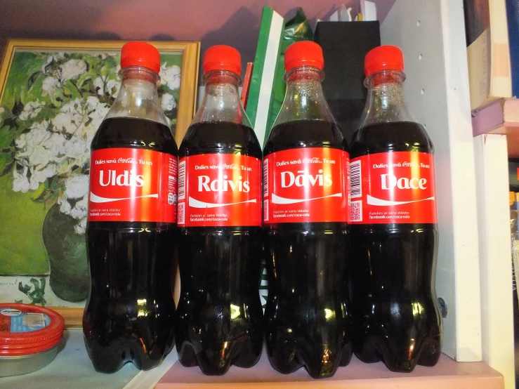 six bottles sitting on top of a shelf