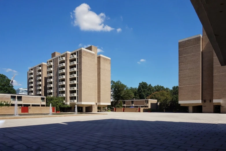 a parking lot that has a few buildings on it