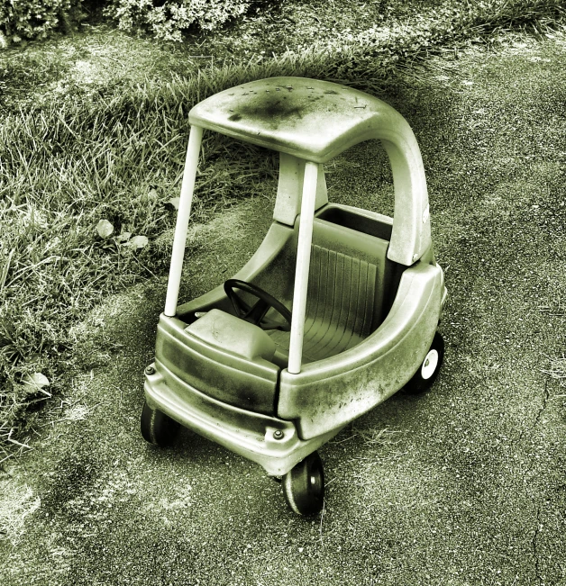 a small suitcase sitting in the dirt