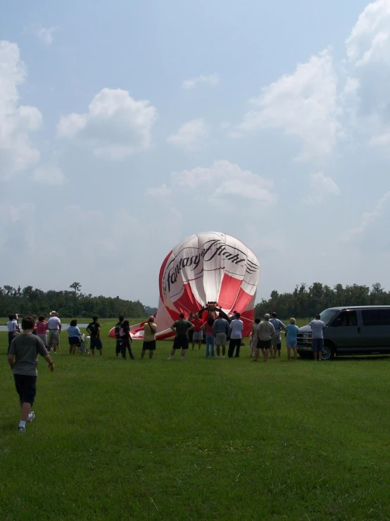 there is a crowd that can be seen flying in a field