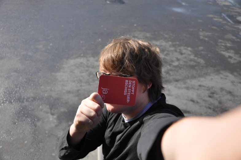 a boy is shown with an electronic device held over his face