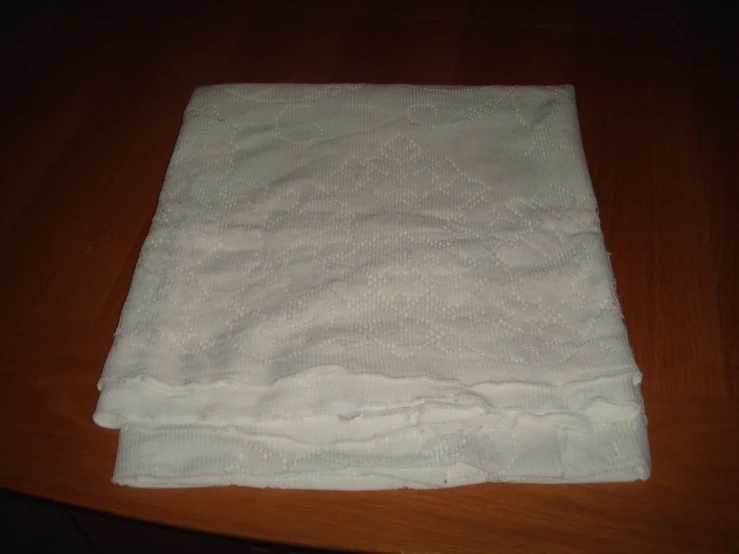 a towel on top of a wooden table