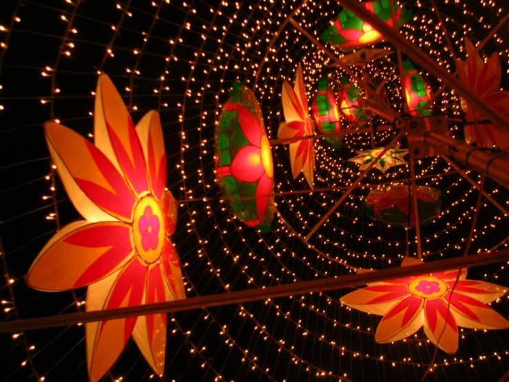 a carousel with colorful lights and decorations in the center
