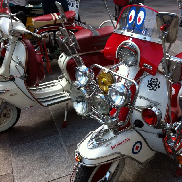 many vintage motorcycles and one is a bug