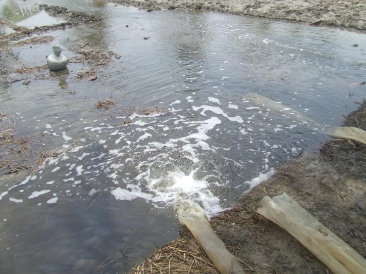 water coming out of the middle of a flooded street