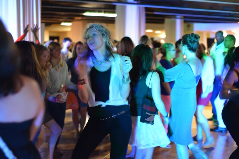 a group of women dancing and having fun