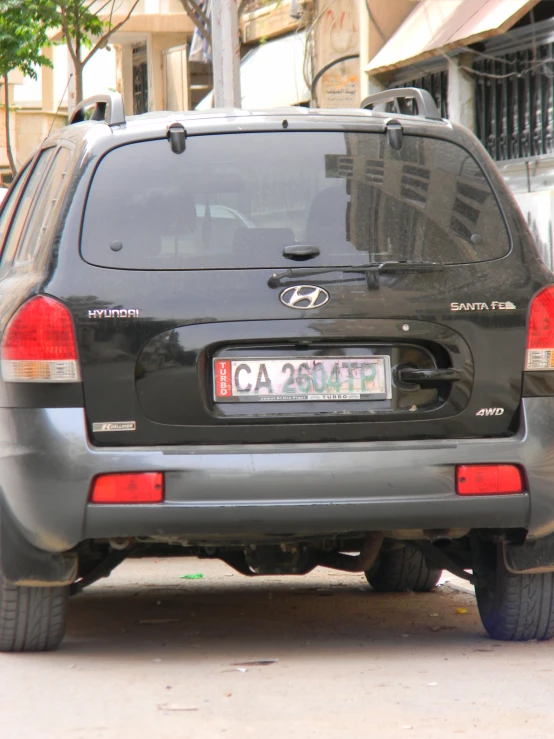 a gray car with a sign reading capritti