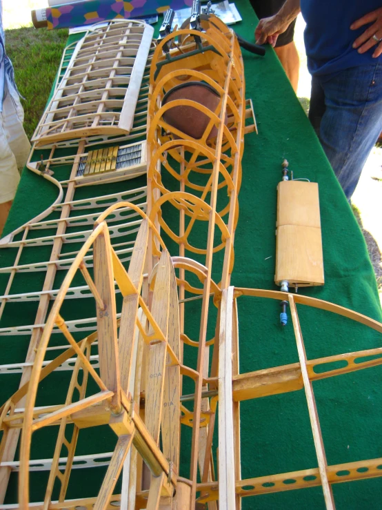 a couple of people with some wooden items in a line