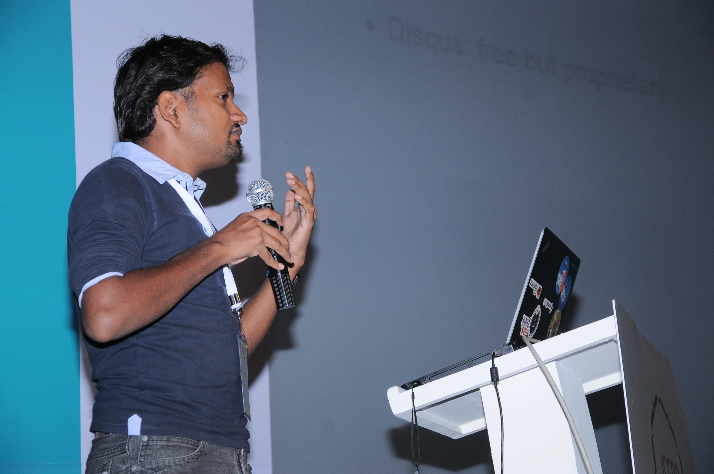 a man giving a talk on a stage