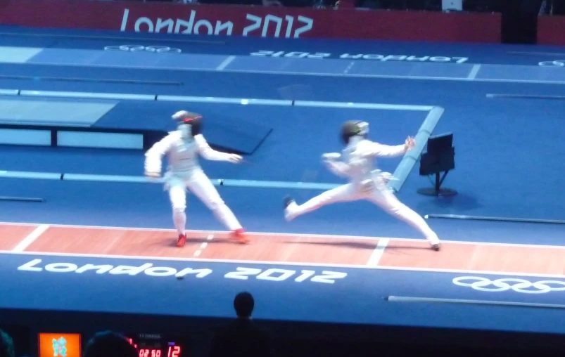 two tennis players on a court during a match