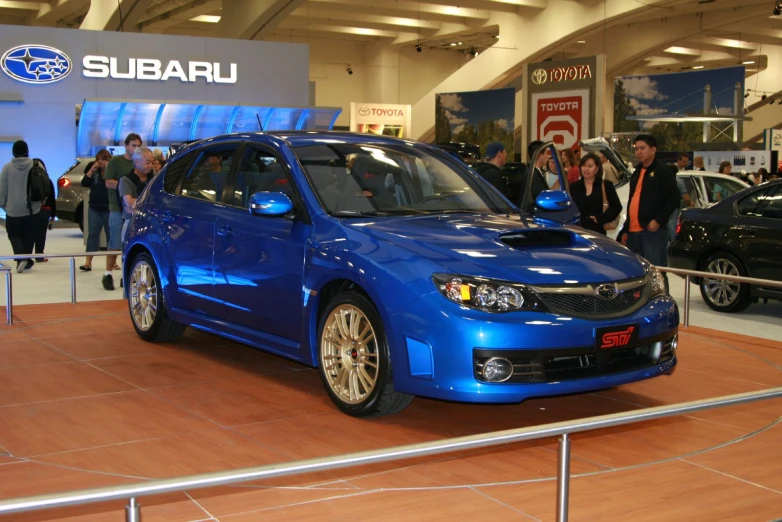a subaru is on display in a building
