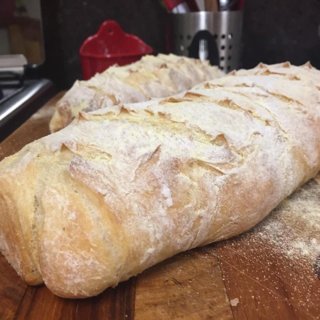 two loaves of bread sit on the counter