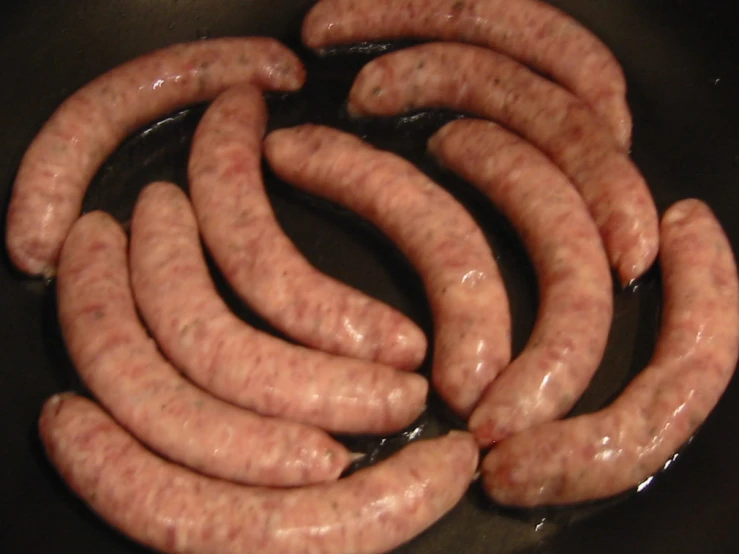 some very thin  dogs ready to be cooked in the oven