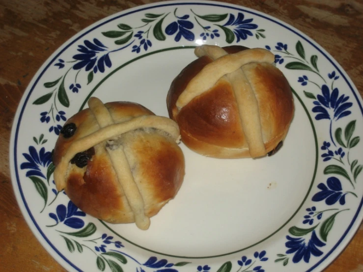 a couple of small rolls are on a plate