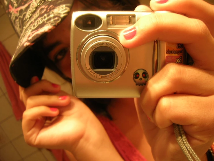 a woman taking a picture with her camera