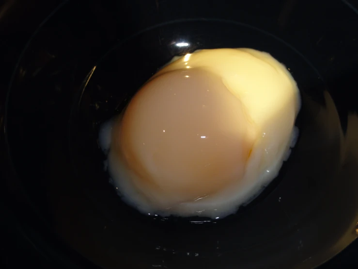 the fried egg is inside of the bowl