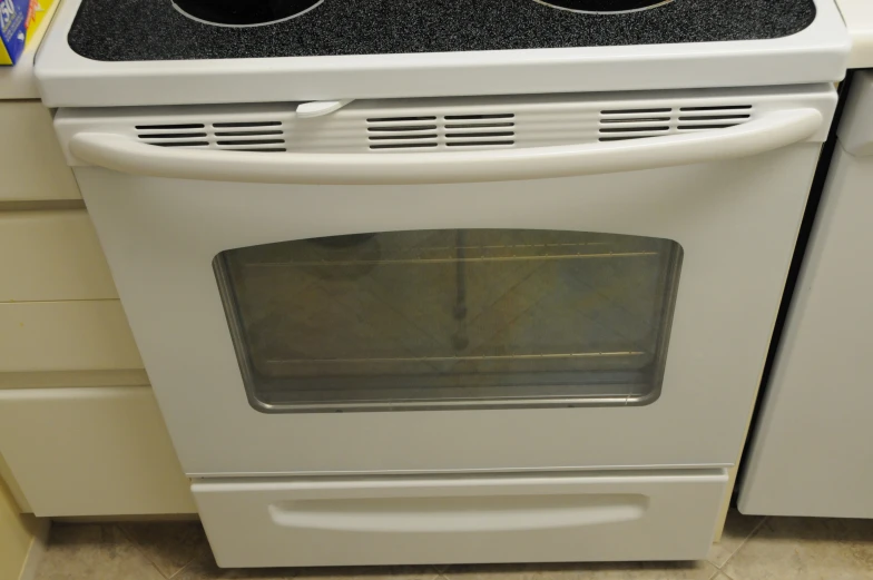 a white stove with two burners on it