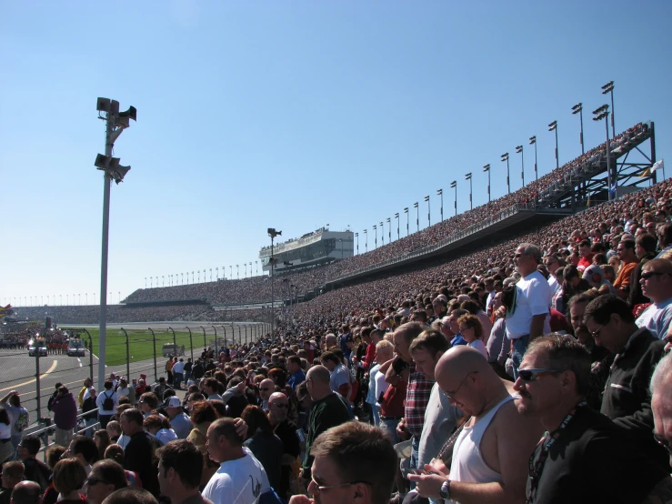 people are seen standing in an empty stadium