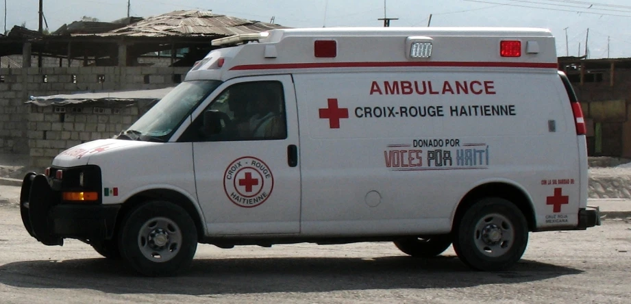 an ambulance truck parked outside in a lot